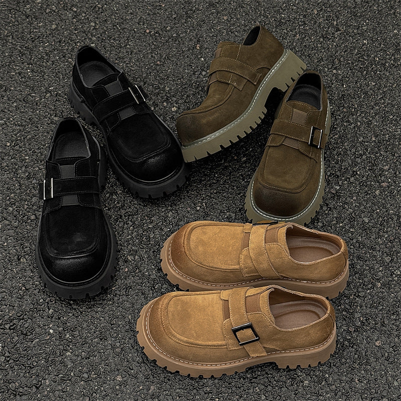 Four pairs of shoes in black and brown on a textured surface